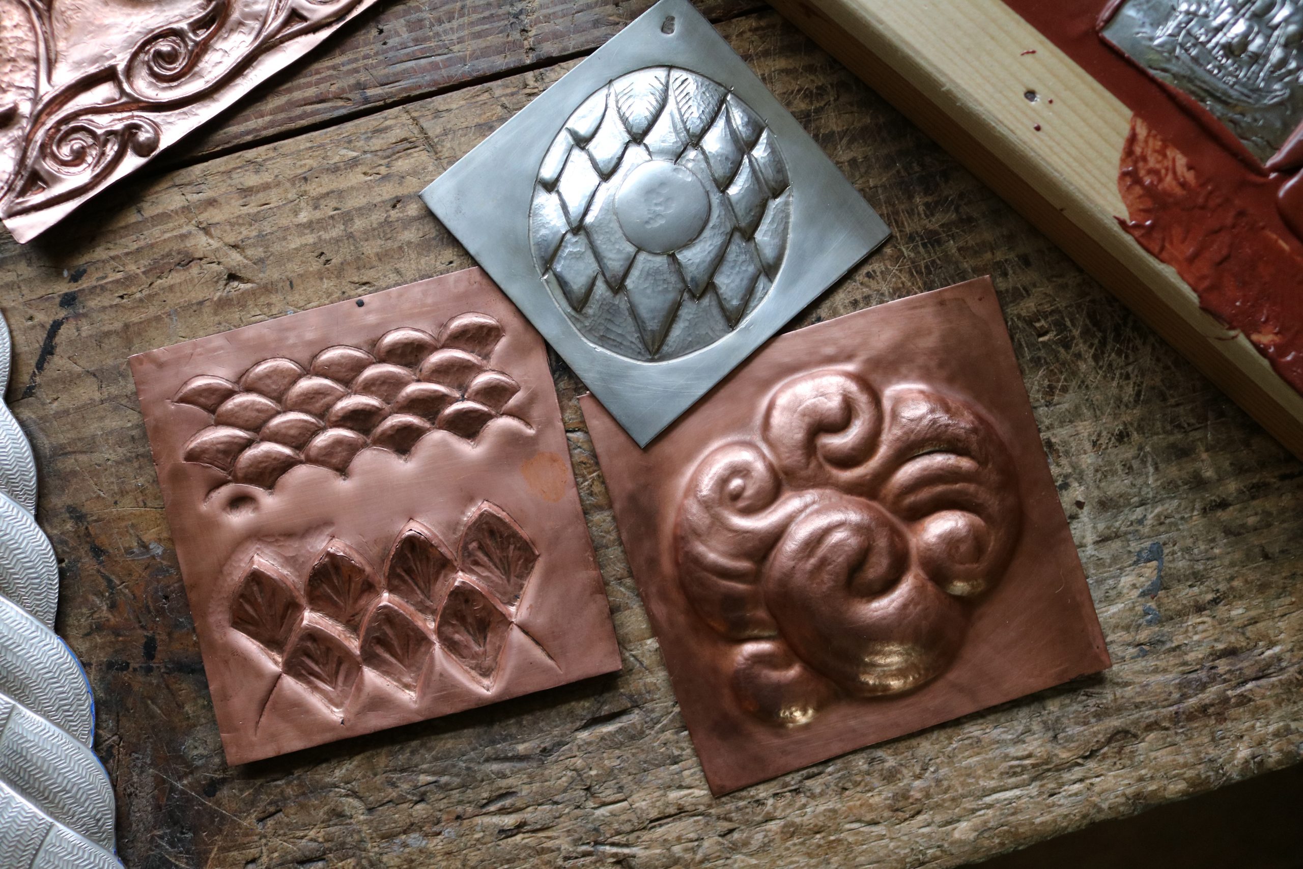 Repousse samples on copper and silver